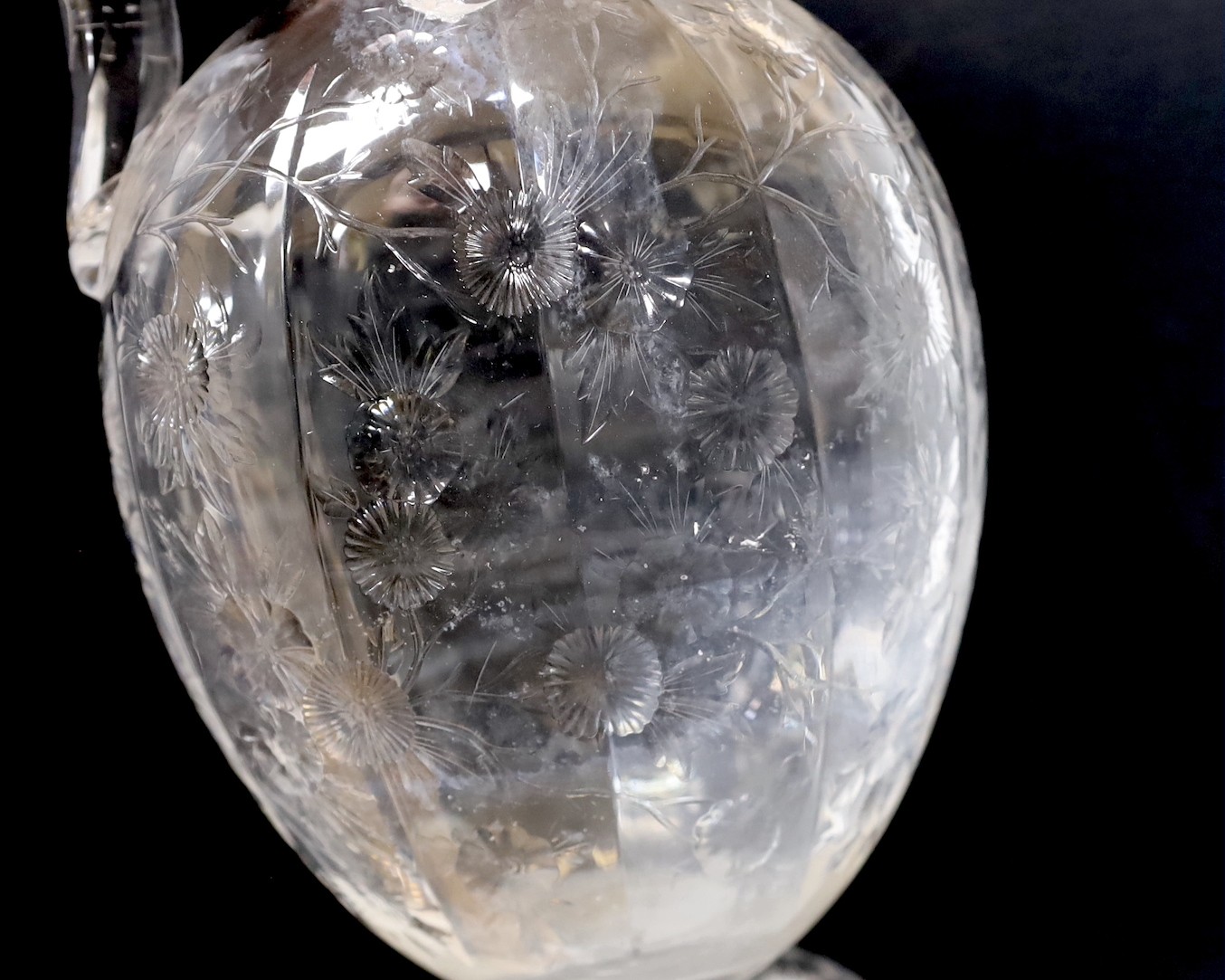 A 19th century Stourbridge ‘’rock crystal’’ claret jug. (cracked). 26.5cm tall
